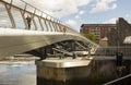 A cyclist crossin the new footbridge across the new flood barrier on the River Lagan at the Donegall Quay in Belfast