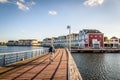 Cyclist crossing a bridge near Colorful row houses in Houten, Ne