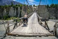 Cyclist crossing wooden bridge Royalty Free Stock Photo