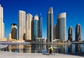 A cyclist cycles the Marina walk, Dubai Marina and