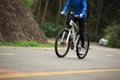 Women cyclist cycling mountain bike on forest trail Royalty Free Stock Photo