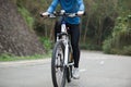 Women cyclist cycling mountain bike on forest trail Royalty Free Stock Photo