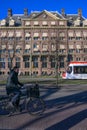 Cyclist cycling on the opposite road of the tram