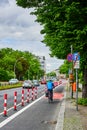 Cyclist in a dedicated cycle lane on a main road