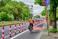 Cyclist in a dedicated cycle lane on a main road