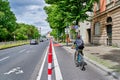 Cyclist in a dedicated cycle lane on a main road