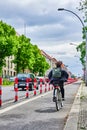 Cyclist in a dedicated cycle lane on a main road