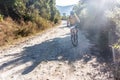 Cyclist on a dirt road in Guatemala highlands. Royalty Free Stock Photo