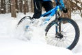 Cyclist Drifting on the Mountain Bike in the Beautiful Winter Forest. Extreme Sport and Enduro Biking Concept. Royalty Free Stock Photo