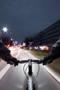 Cyclist drives on the bike path past the traffic jam Royalty Free Stock Photo