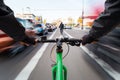 Cyclist drives on the bike path past the traffic jam