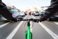 Cyclist drives on the bike path past the traffic jam