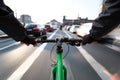 Cyclist drives on the bike path past the traffic jam - First-person view of cyclist