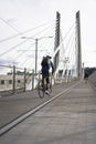 Cyclist on road bike is riding Tilikum Crossing Bridge