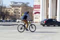 The cyclist goes on the highway in the city