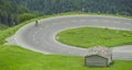 Cyclist on hairpin curve on Grossglockner Royalty Free Stock Photo