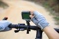 Cyclist hands set the action camera Royalty Free Stock Photo