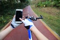Cyclist hands use gps navigator on smartphone