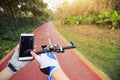 Cyclist hands use gps navigator on smartphone