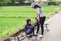 cyclist having a leg cramps while riding in the morning Royalty Free Stock Photo