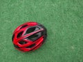 Cyclist helmet on artificial grass floor. Sports. Cycling