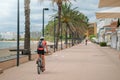 Cyclist in helmet on a bike path on the promenade