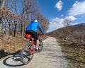 Cyclist with helmet on a path in the countryside Royalty Free Stock Photo