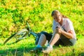 Cyclist holds a his bruised knee Royalty Free Stock Photo