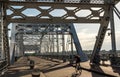 Cyclist on John Seigenthaler pedestrian bridge or Shelby street crossing at sunrise in Nashville Royalty Free Stock Photo