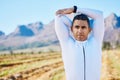 Cyclist man, stretching arms or thinking of race, fitness or travel in nature for wellness by mountains. Warm up Royalty Free Stock Photo