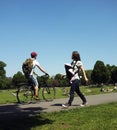 A cyclist and mother with her baby in a park Royalty Free Stock Photo