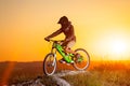 Cyclist with mountain bike on the hill in the evening Royalty Free Stock Photo