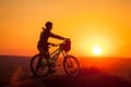 Cyclist with mountain bike on the hill in the evening Royalty Free Stock Photo
