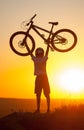 Cyclist with mountain bike on the hill in the evening Royalty Free Stock Photo