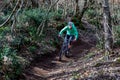 Cyclist in a mountain bike runs alone on the country path