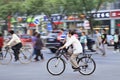 Cyclist with mouth cap on the street, Beijing, China