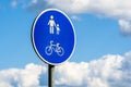 Cyclist & pedestrian road sign on the sky background