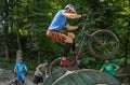 LVIV, UKRAINE - JUNE 2018: A cyclist performs tricks on a bicycle trial to overcome an obstacle course