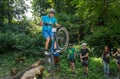 LVIV, UKRAINE - JUNE 2018: A cyclist performs tricks on a bicycle trial to overcome an obstacle course