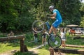 LVIV, UKRAINE - JUNE 2018: A cyclist performs tricks on a bicycle trial to overcome an obstacle course