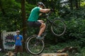 LVIV, UKRAINE - JUNE 2018: A cyclist performs tricks on a bicycle trial to overcome an obstacle course