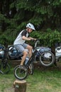 LVIV, UKRAINE - JUNE 2018: A cyclist performs tricks on a bicycle trial to overcome an obstacle course Royalty Free Stock Photo