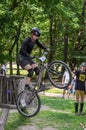 LVIV, UKRAINE - JUNE 2018: A cyclist performs tricks on a bicycle trial to overcome an obstacle course Royalty Free Stock Photo