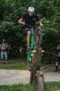 LVIV, UKRAINE - JUNE 2018: A cyclist performs tricks on a bicycle trial to overcome an obstacle course