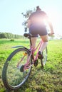 Cyclist in the rays of the setting sun Royalty Free Stock Photo