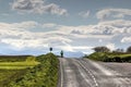 Cyclist on a remote road Royalty Free Stock Photo