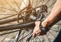 A cyclist repairs a bicycle wheel