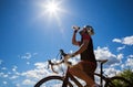 Cyclist resting and drinking isotonic drink.