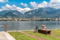 Cyclist resting on the Lakefront of Malgrate located on the shore of Como Lake in province of Lecco. Royalty Free Stock Photo