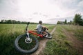 Cyclist resting while traveling at the country Royalty Free Stock Photo